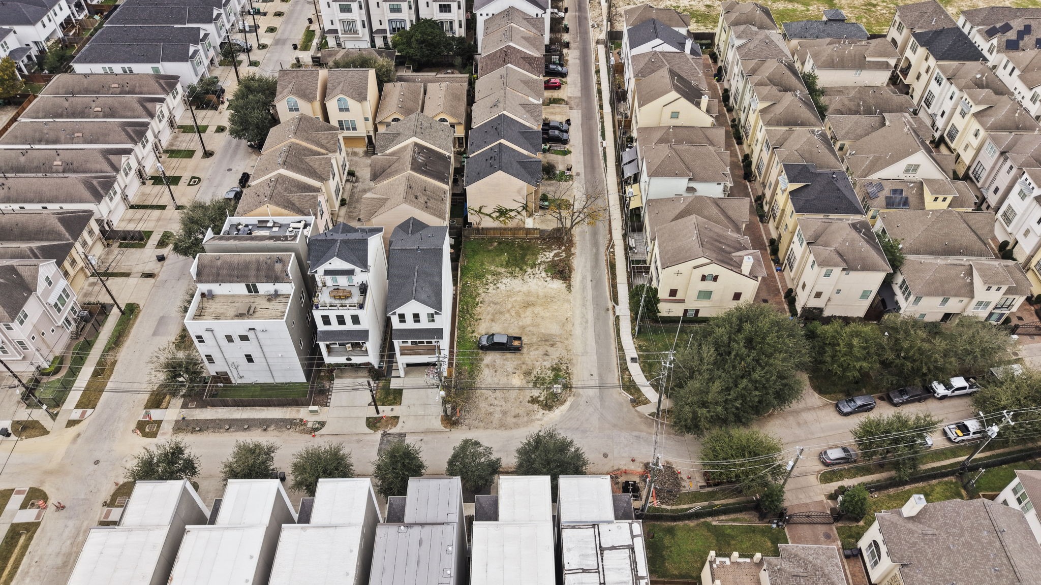 5807 Katy Street Houston, TX 77007 - Photo 21 of 37 This wide-angle aerial perfectly captures the property's central location. Surrounded by a sea of modern rooftops and lush green pockets, it offers the perfect balance of city energy and residential prestige.