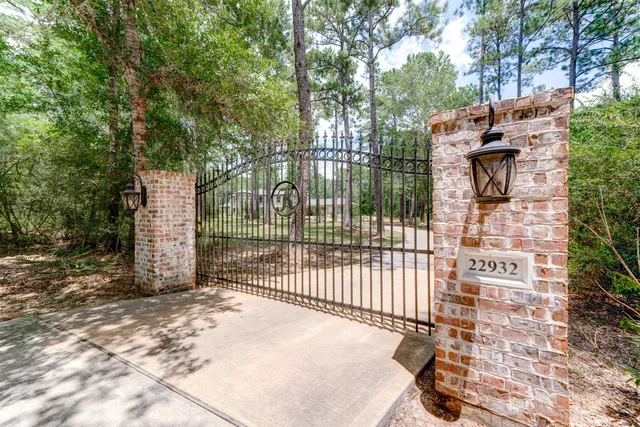 a view of a wrought iron fences in front of house