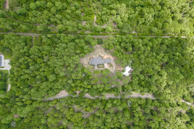 an aerial view of residential house with outdoor space