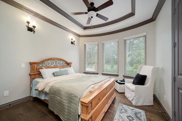 a bedroom with a bed and a mirror