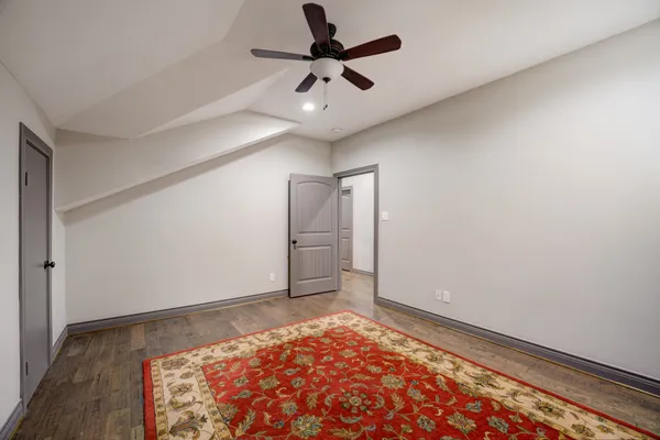 a bedroom with bed and window