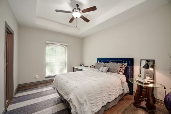 a bedroom with a bed and a view of closet