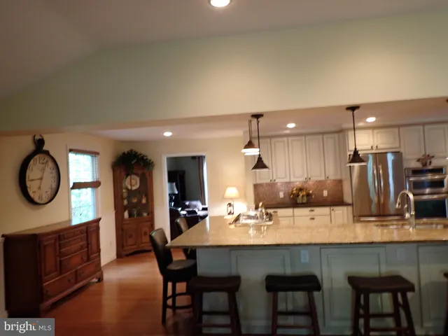 a kitchen with a table and chairs in it