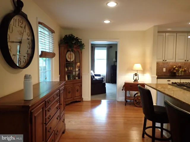 a view of a hallway with seating area