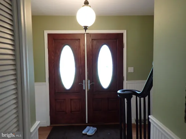 a bathroom with a mirror and a sink