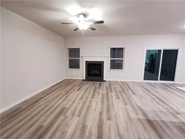 a view of empty room with a fireplace