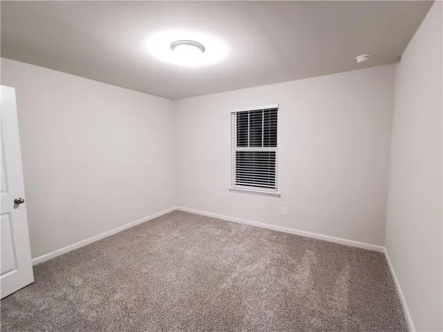 a bathroom with a double vanity sink toilet mirror and shower