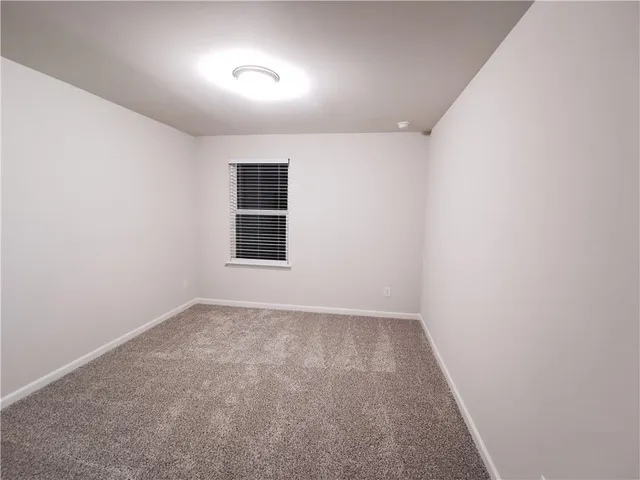 a bathroom with a sink a bathtub a mirror and vanity