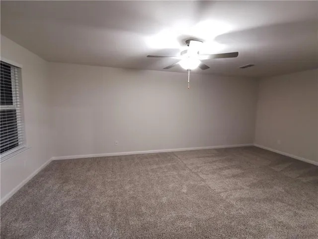 a bathroom with a shower and a bath tub