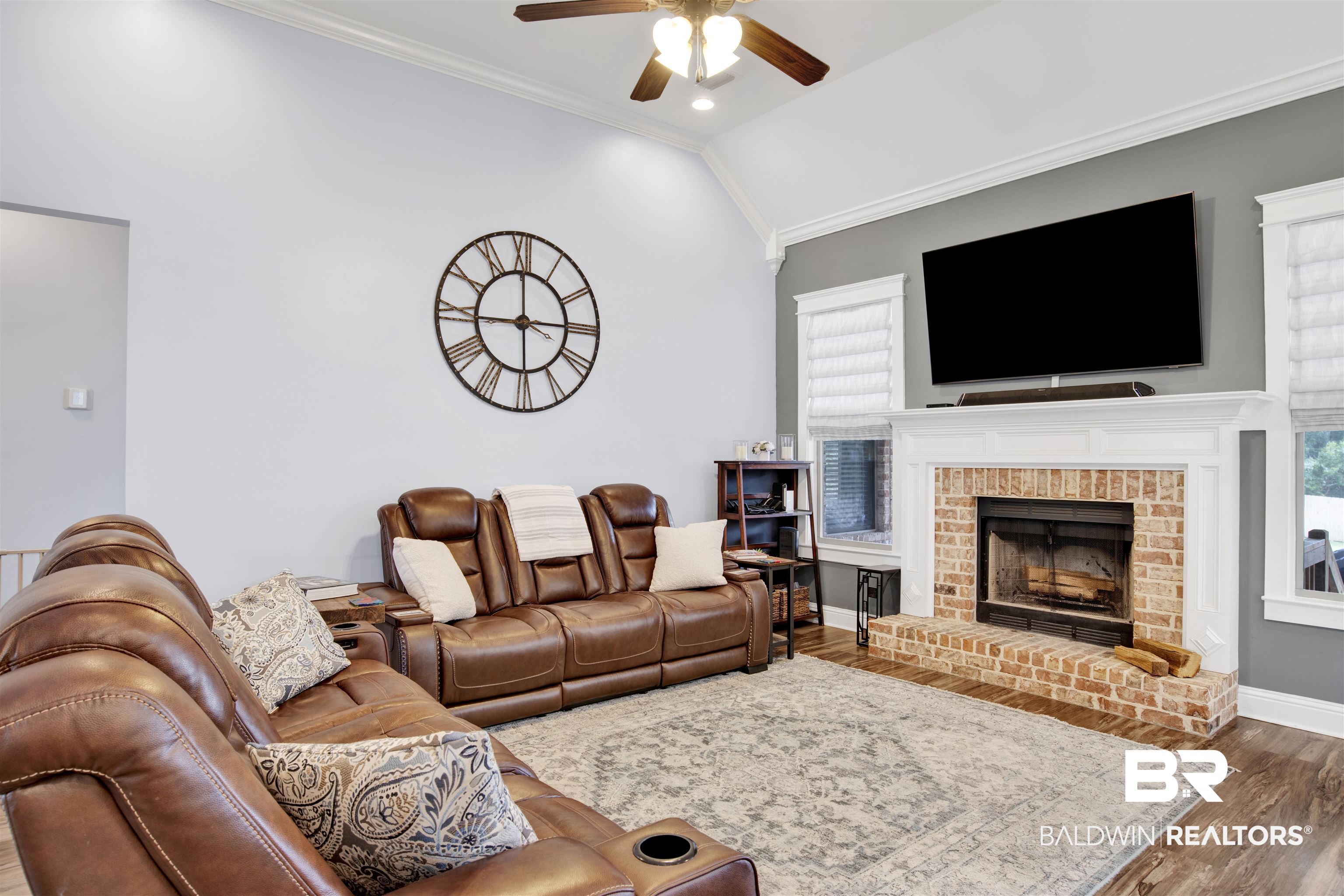 12418 Cambron Trail Daphne, AL 36527 - Photo 18 of 44 Living room with a fireplace, ornamental molding, ceiling fan, dark hardwood / wood-style floors, and lofted ceiling