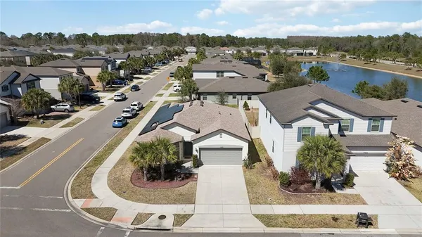 an aerial view of a house with a garden