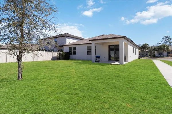 a front view of house with yard and green space