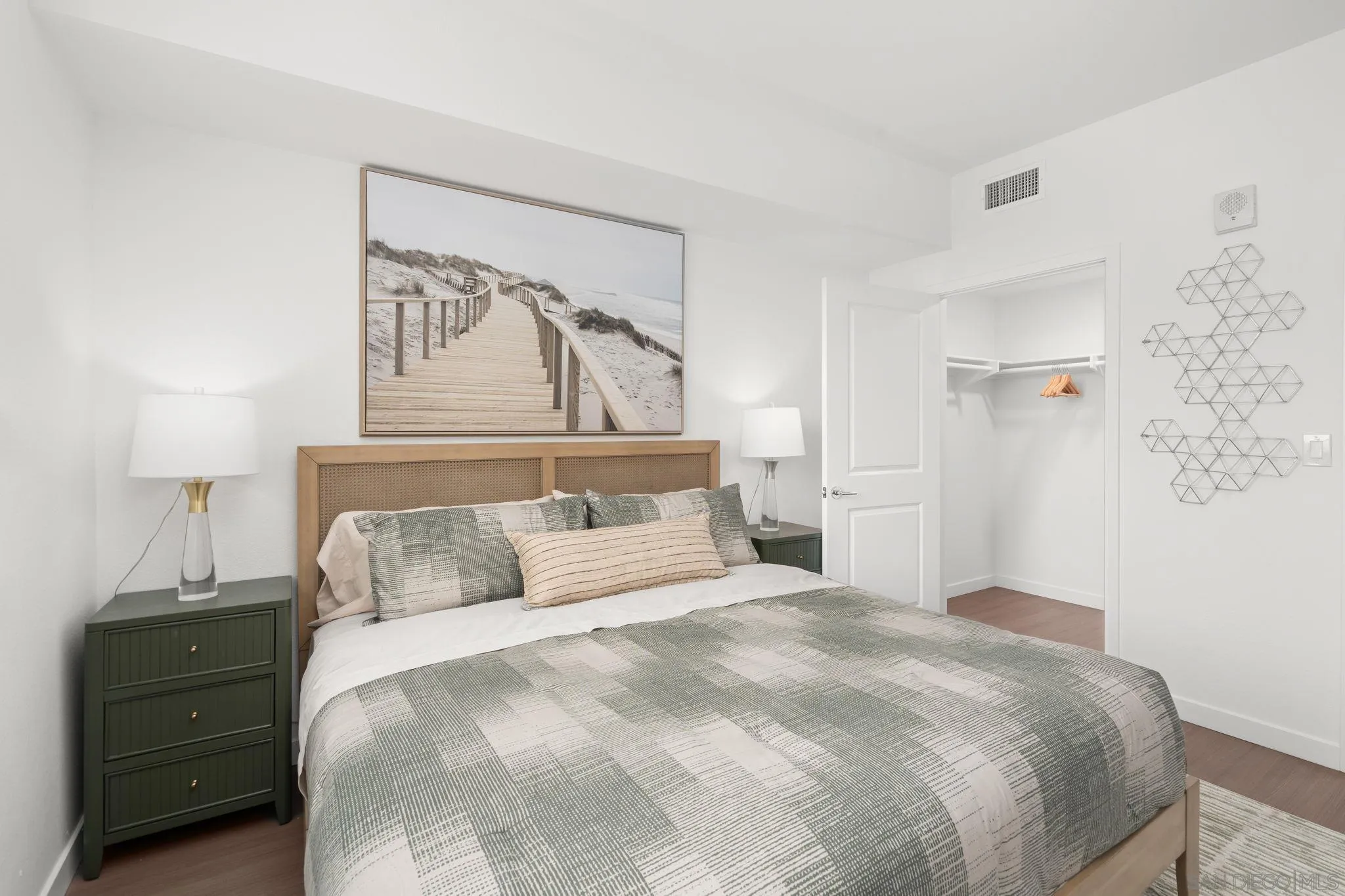 2724 El Cajon Boulevard, Unit 602 San Diego, CA 92104 - Photo 14 of 21 a bedroom with a bed and a night stand