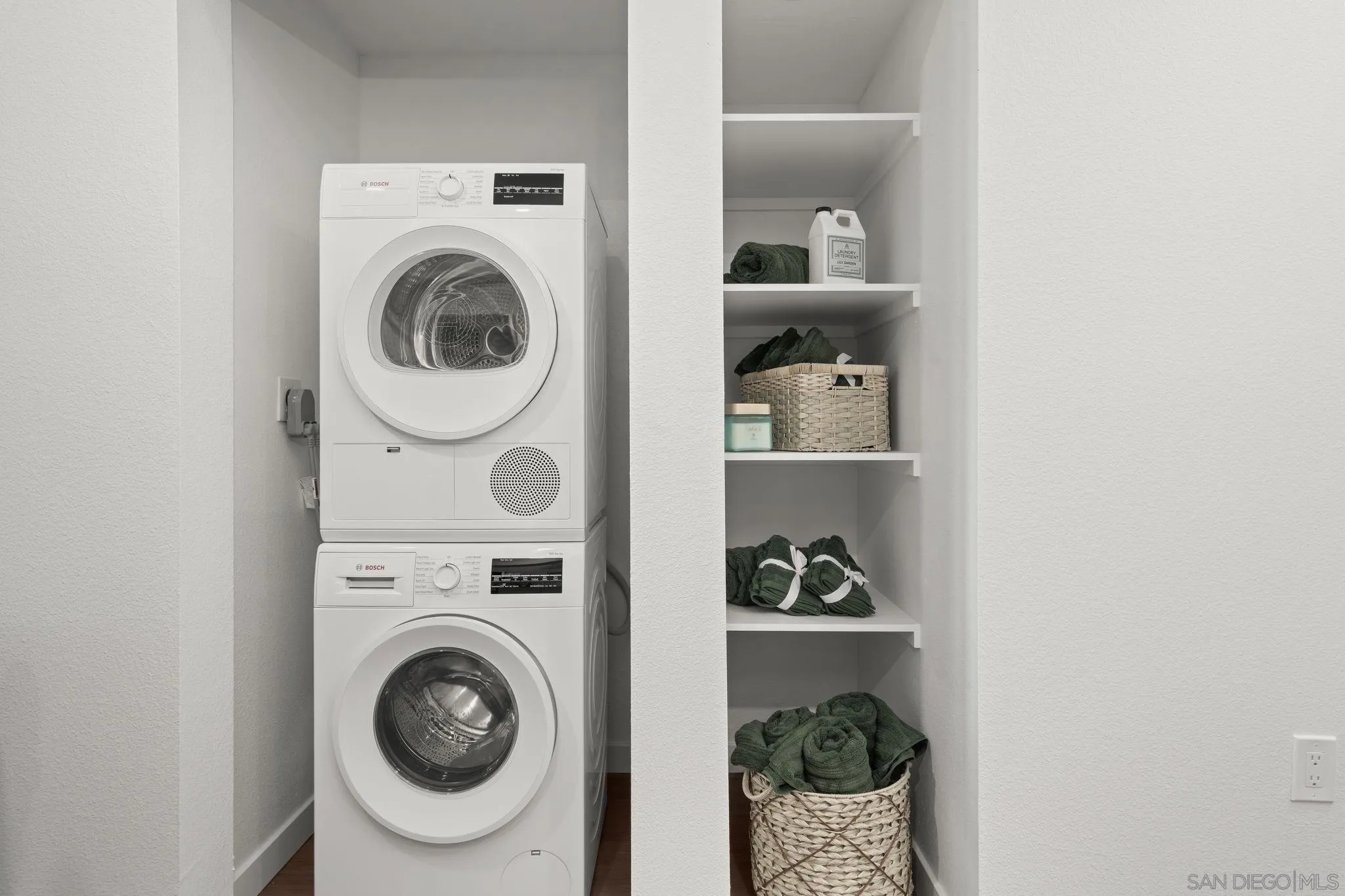 2724 El Cajon Boulevard, Unit 602 San Diego, CA 92104 - Photo 18 of 21 a view of a hallway with washer and dryer