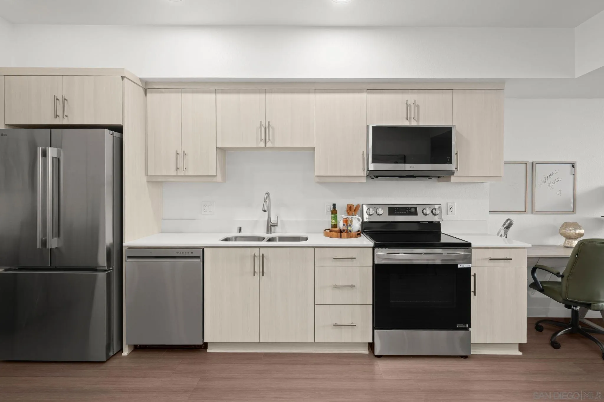 2724 El Cajon Boulevard, Unit 602 San Diego, CA 92104 - Photo 2 of 21 a kitchen with cabinets stainless steel appliances and a counter space