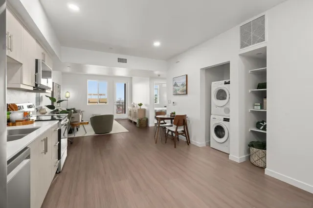 a living room with furniture dining table and wooden floor