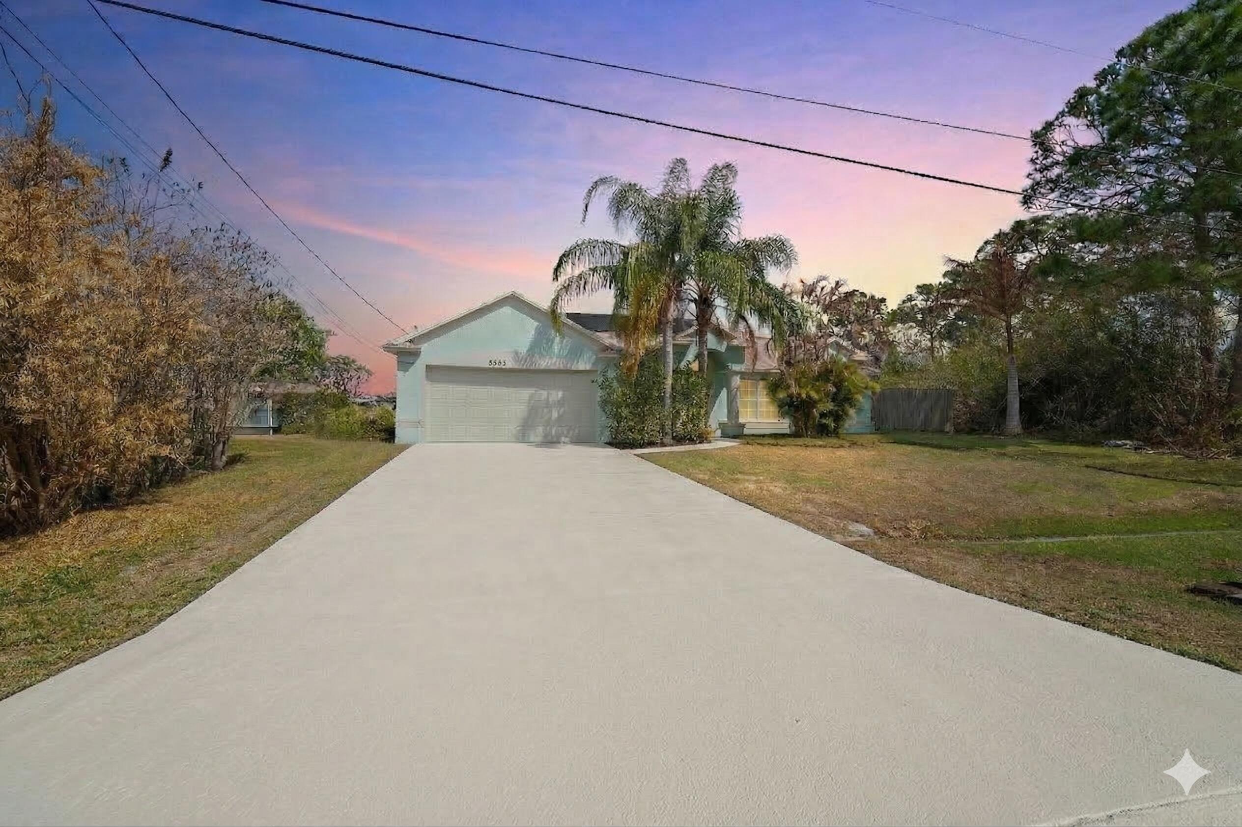 5593 Northwest Wesley Road Port St. Lucie, FL 34986 - Photo 27 of 33 Twilight photo front exterior