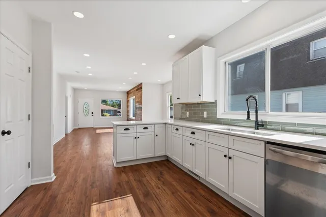 a large kitchen with cabinets