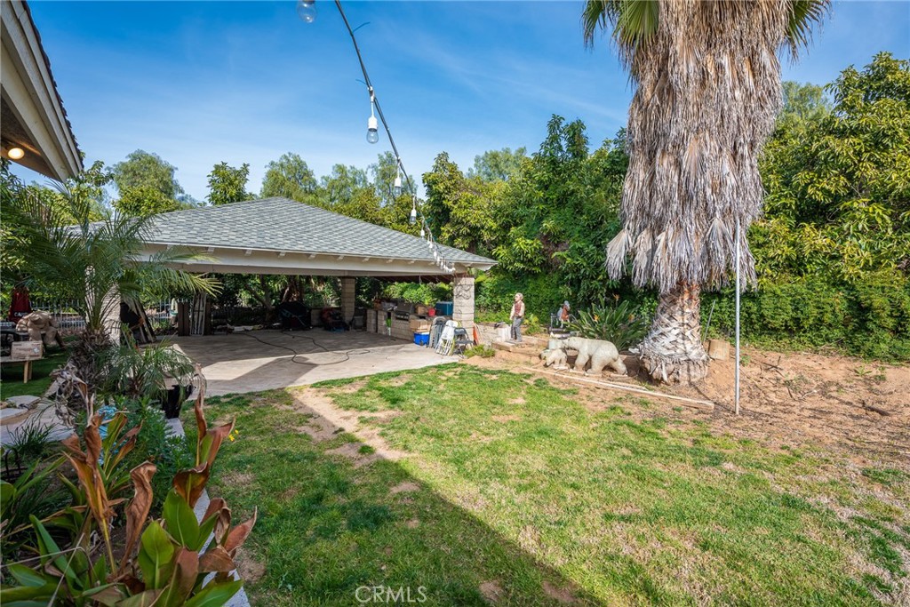1413 Irving Street Riverside, CA 92504 - Photo 18 of 29 a view of house with backyard and swimming pool