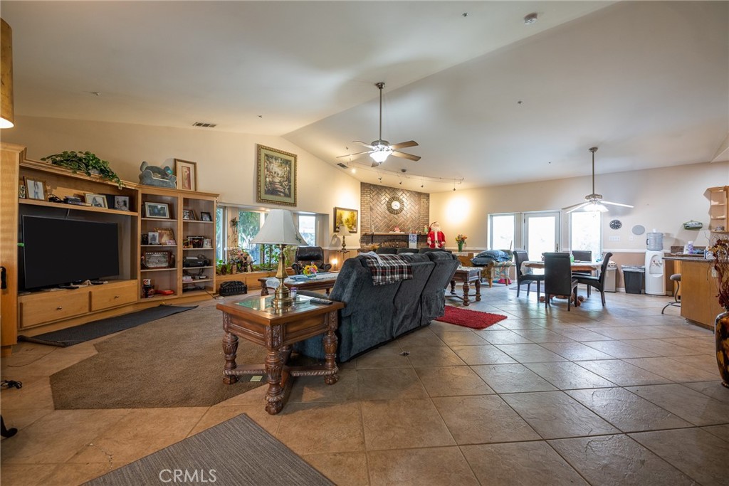 1413 Irving Street Riverside, CA 92504 - Photo 5 of 29 a living room with lots of furniture and a flat screen tv