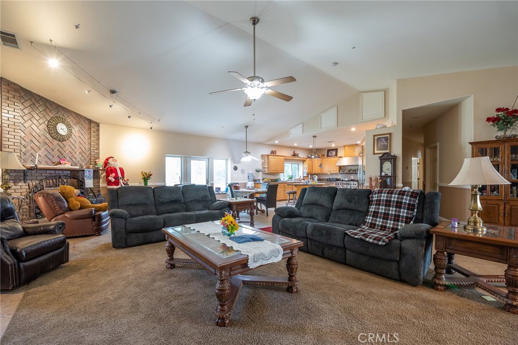 1413 Irving Street Riverside, CA 92504 - Photo 6 of 29 a living room with furniture and a chandelier