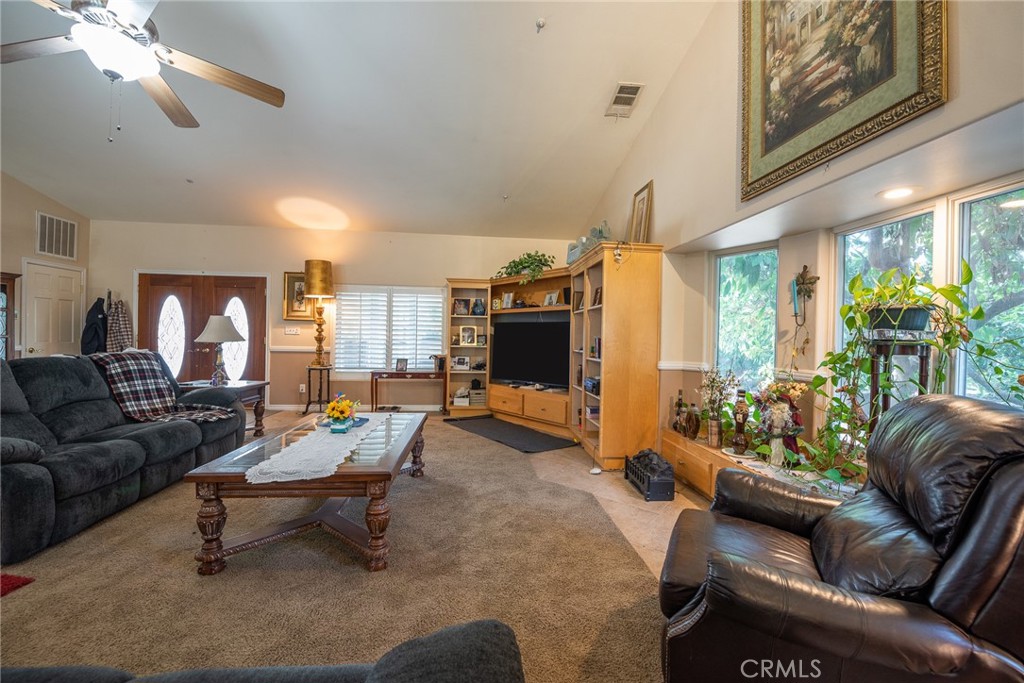 1413 Irving Street Riverside, CA 92504 - Photo 7 of 29 a living room with furniture and a large window