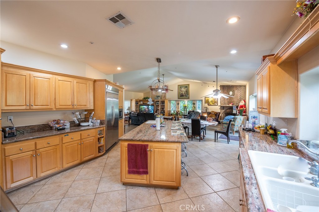 1413 Irving Street Riverside, CA 92504 - Photo 8 of 29 a large kitchen with lots of counter space and furniture
