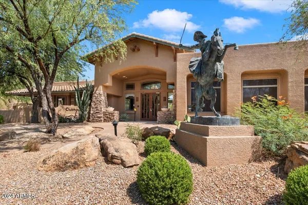 a living room with fireplace furniture and a large window