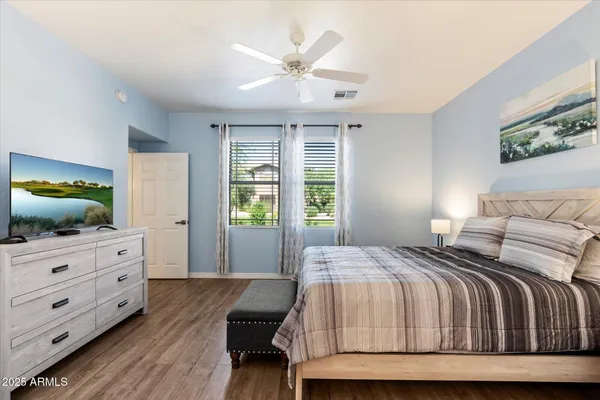 a bedroom with a bed and window