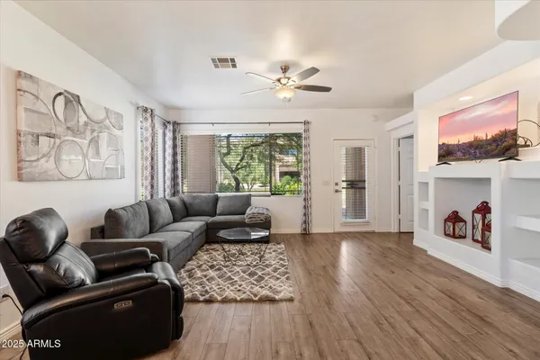 a view of a dining room with furniture window and wooden floor