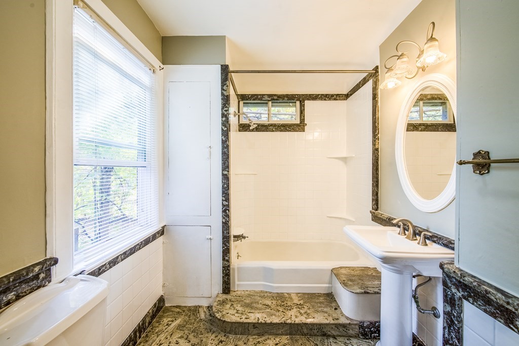 129 Florence Street Springfield, MA 01105 - Photo 10 of 16 a bathroom with a granite countertop sink toilet and shower