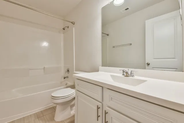 a view of walk in closet with wooden floor