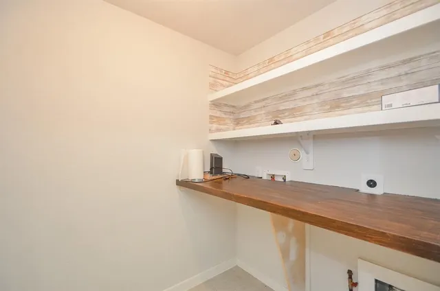 a kitchen with a sink stove top oven and cabinets