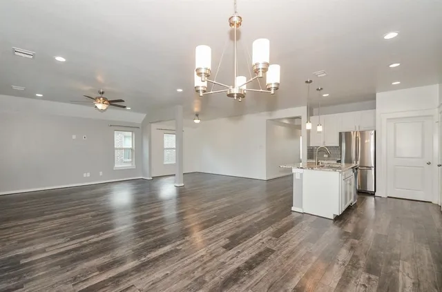 a kitchen with a sink and cabinets