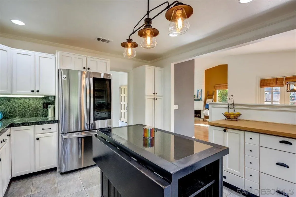 861 Shade Tree Lane Fallbrook, CA 92028 - Photo 11 of 49 a kitchen with stainless steel appliances granite countertop a sink a stove and a refrigerator
