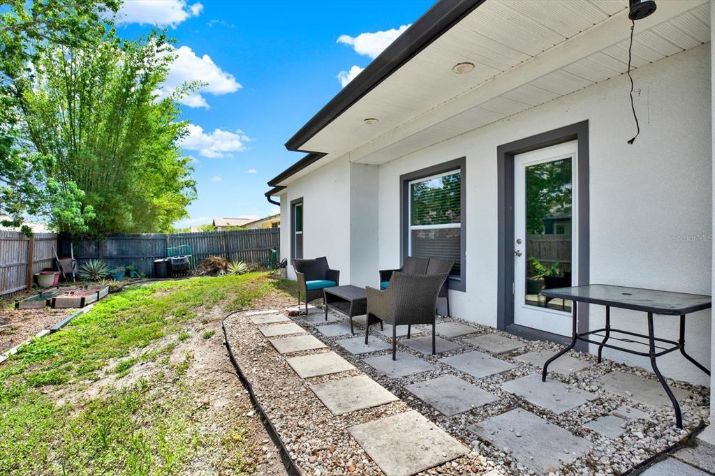 3023 Muir Street Holiday, FL 34691 - Photo 21 of 25 a building outdoor space with patio furniture