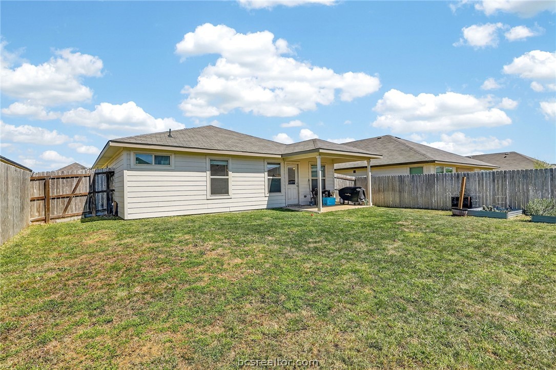 5235 Montague Loop Bryan, TX 77807 - Photo 22 of 25 a view of a house with a backyard