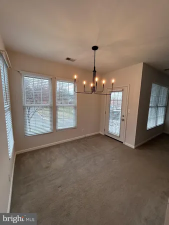 a kitchen with stainless steel appliances a stove a sink and a microwave