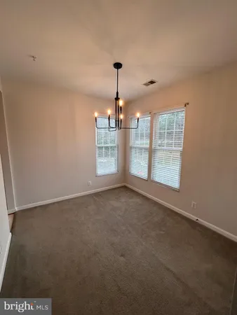 a kitchen with stainless steel appliances a stove a sink and a microwave