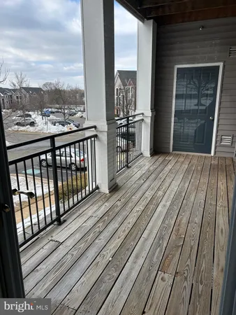 a view of a balcony with wooden floor