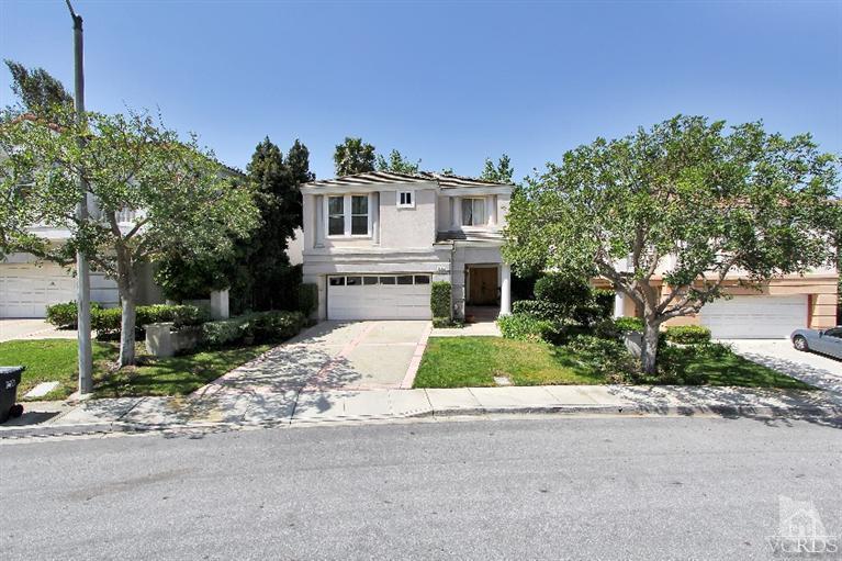 3853 Timberridge Road Moorpark, CA 93021 - Photo 1 of 42 a white house with a small yard and large trees with plants