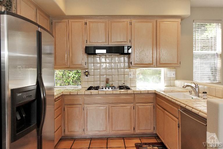3853 Timberridge Road Moorpark, CA 93021 - Photo 13 of 42 a kitchen with appliances cabinets and a sink