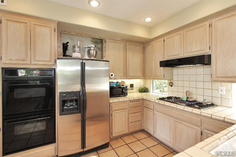 3853 Timberridge Road Moorpark, CA 93021 - Photo 14 of 42 a kitchen with cabinets stainless steel appliances and counter space