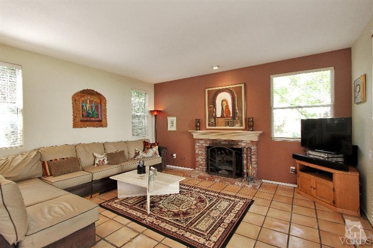 3853 Timberridge Road Moorpark, CA 93021 - Photo 15 of 42 a living room with furniture a fireplace and a window