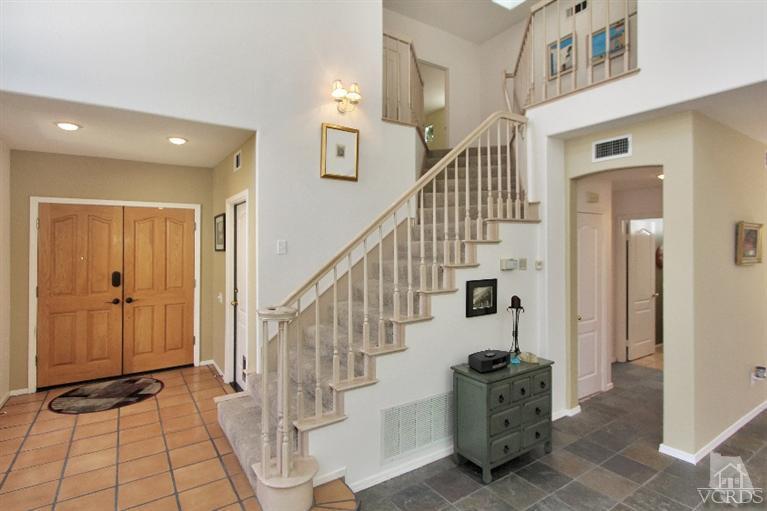 3853 Timberridge Road Moorpark, CA 93021 - Photo 18 of 42 a view of a hallway with wooden floor and staircase