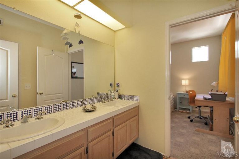 3853 Timberridge Road Moorpark, CA 93021 - Photo 22 of 42 a bathroom with a sink double vanity and a mirror