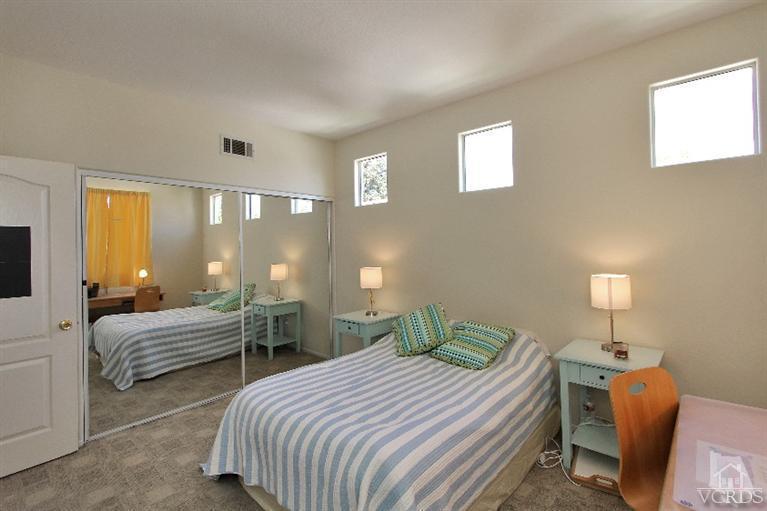 3853 Timberridge Road Moorpark, CA 93021 - Photo 23 of 42 a bedroom with two beds and a lamp