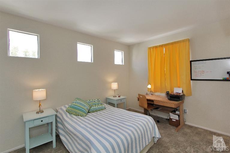 3853 Timberridge Road Moorpark, CA 93021 - Photo 24 of 42 a bedroom with a bed and a lamp on table window