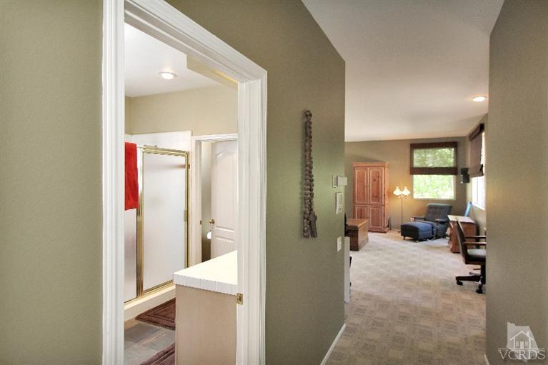 3853 Timberridge Road Moorpark, CA 93021 - Photo 25 of 42 a view of a hallway with wooden floor and furniture