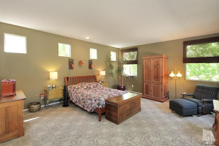 3853 Timberridge Road Moorpark, CA 93021 - Photo 27 of 42 a bedroom with a bed and large windows